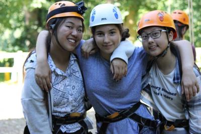 teenage girls climbing at activity camp in the uk near london