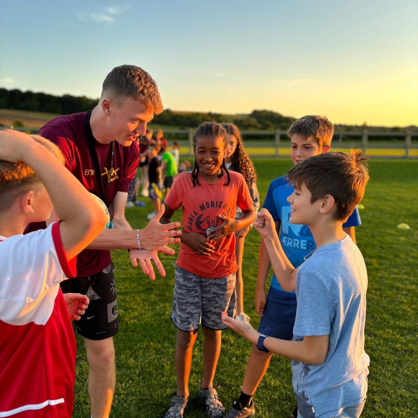 children doing welcome activities at XUK summer camp