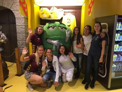 teenage girls on trip to london sightseeing with staff on residential summer activity camp trip