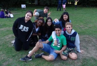 teenage boys and girls smiling at summer camp activity london uk