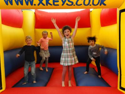happy children bouncy castle activity day camp london uk