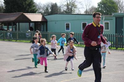 camp manager being chased by happy children