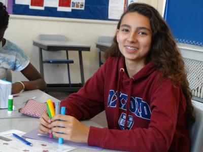 smiling teenager in english lesson at best summer school in england