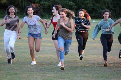 teenage girls running uk summer camp fun
