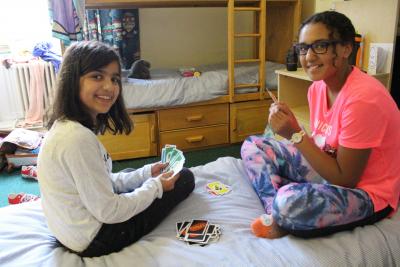 girls playing cards at activity summer camp