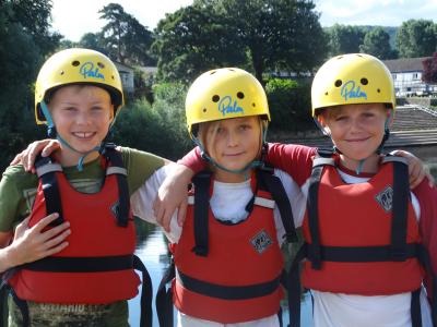 teen boys kayaking british summer camp