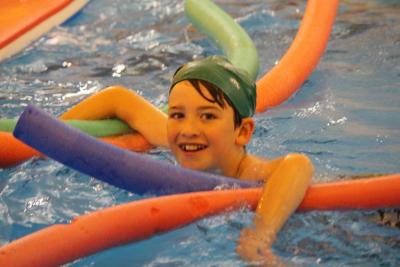 boy in swimming pool best british summer camp uk