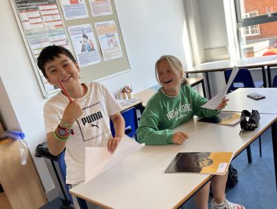 Two children laughing during their lesson at english uk summer school