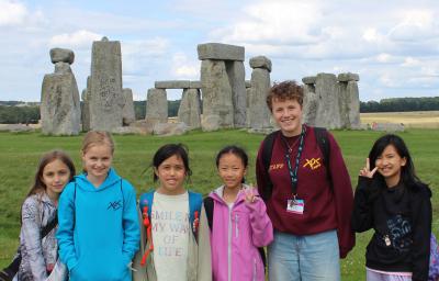 group of children at Stonehenge on a trip with one of the best summer camps in the UK