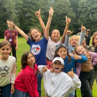 Happy girls making friends at XUk Summer camp