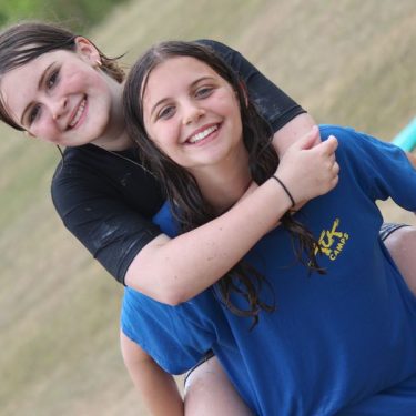 Friends having fun helping kids overcome homesickness