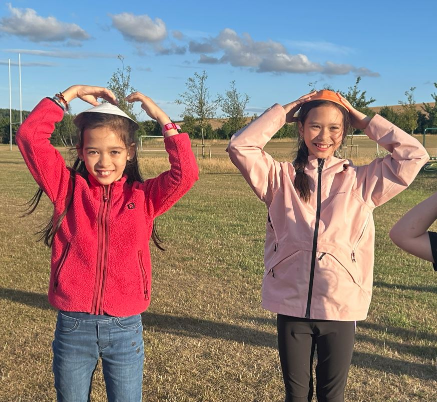 Children excited for their first summer camp at XUK, prepared and happy for their first time away from home