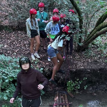Teenagers at XUK overnight summer camp participating in team-building games