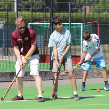 XUK summer camp UK staff leading children in sports activities at a Sports Summer camp
