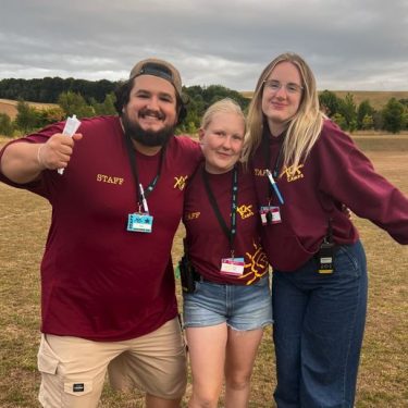 Friendly XUK Camps staff promoting sustainable summer camp practices and teamwork in the UK